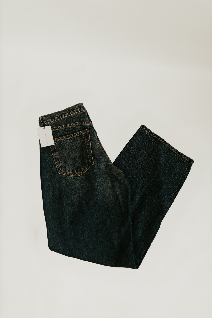 Flat lay of the back side of the Willow Relaxed Straight Jean in dark denim by studio hill designs on white background.