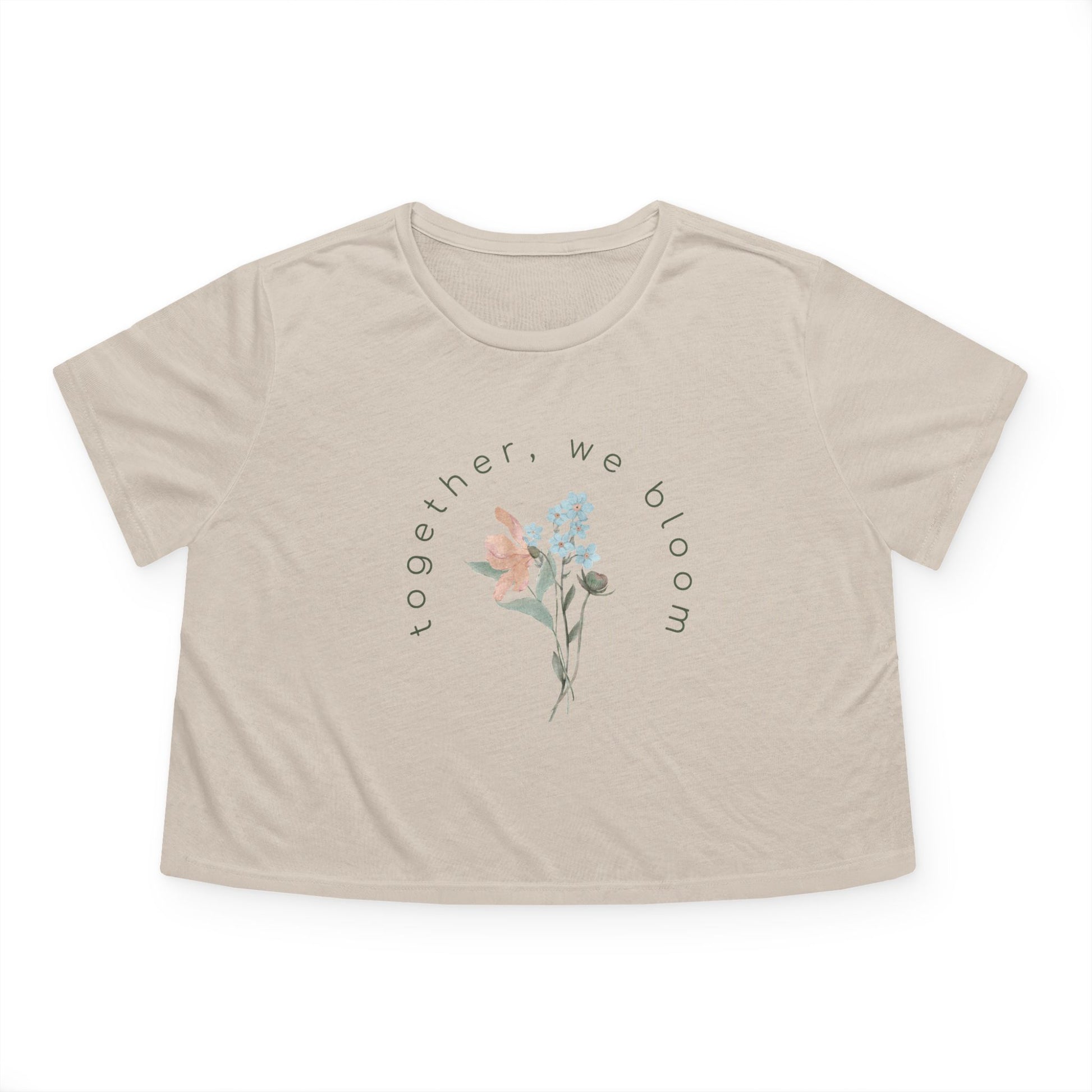 Beige cropped t-shirt by studio hill designs with floral design and text 'together we bloom'  on a white background