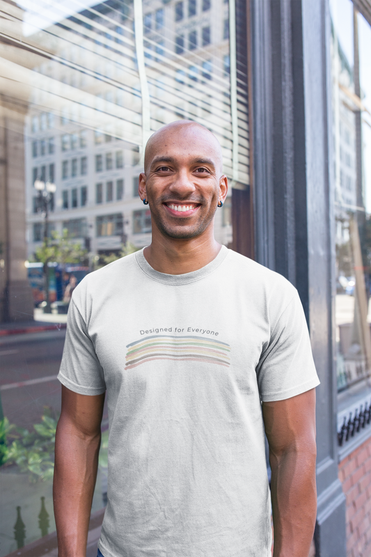 Mockup of a happy man wearing the designed for everyone rainbow graphic tee created by Studio Hill Designs