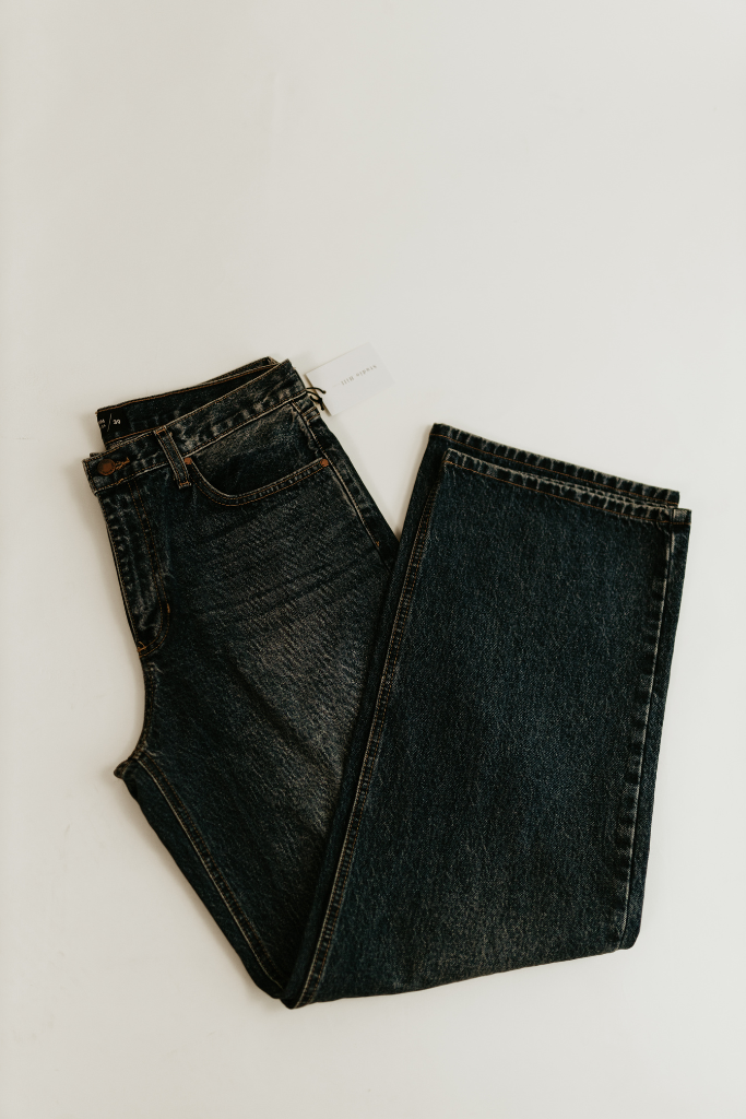Flat lay of the front side of the Willow Relaxed Straight Jean in dark denim by studio hill designs on white background.